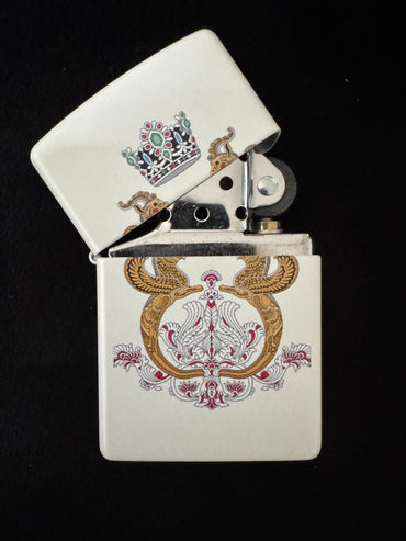 White lighter with Shahbanu Farah Pahlavi imperial arms and royal crown on black background