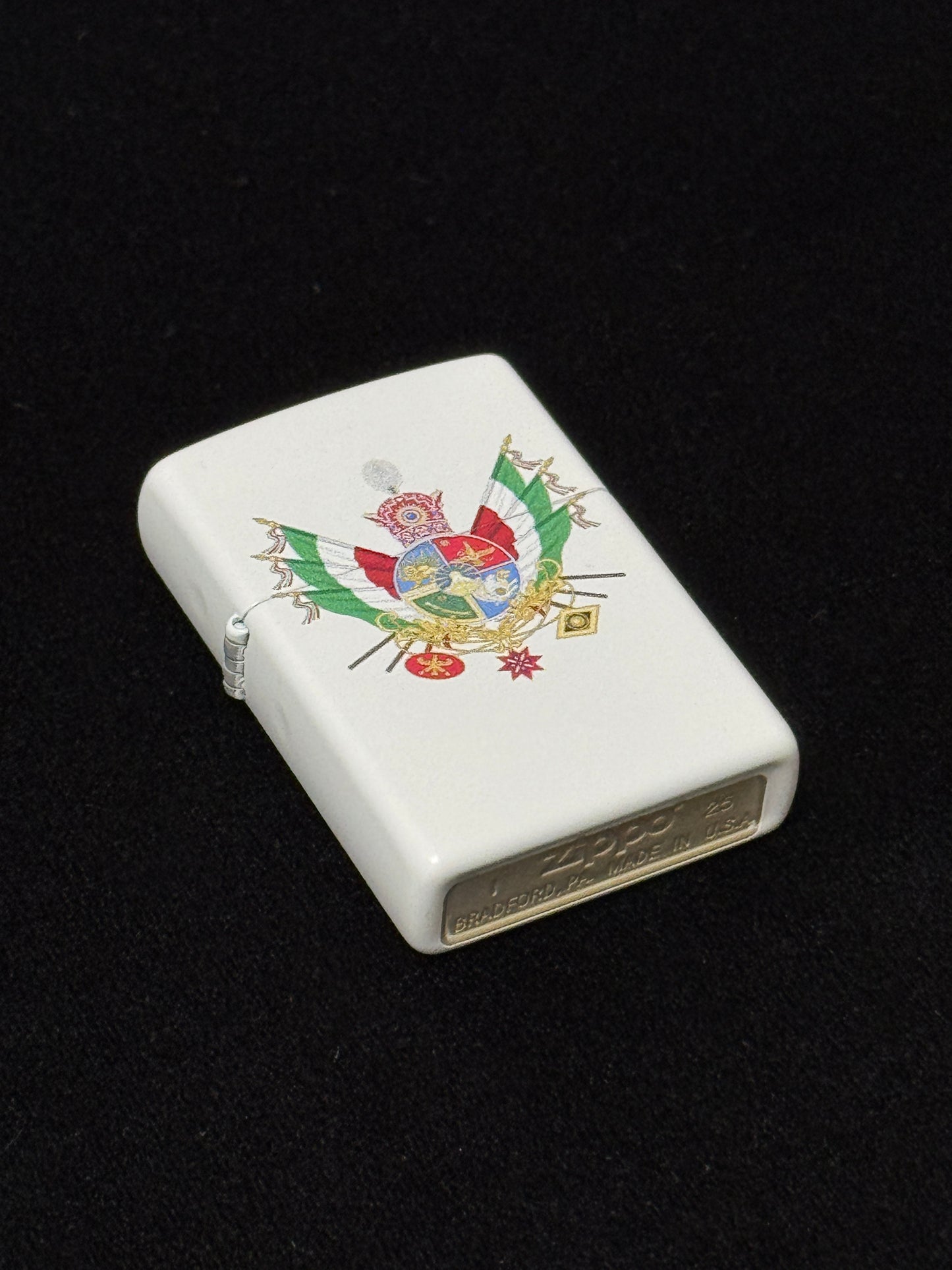 White lighter with Shahanshah of Iran Imperial Standard emblem, Pahlavi Crown, Iranian tricolor flags, and royal symbol on black background